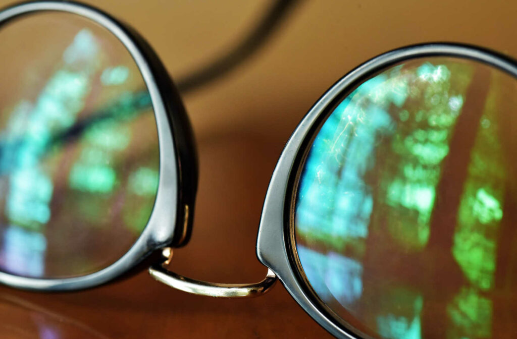 A close up of a pair of glasses showing how the lenses have a clear, anti-reflective coating