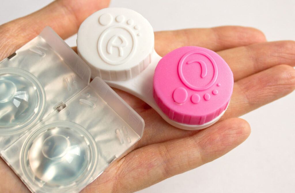 A new pair of contact lenses and cases, replacement from dried-out lenses.