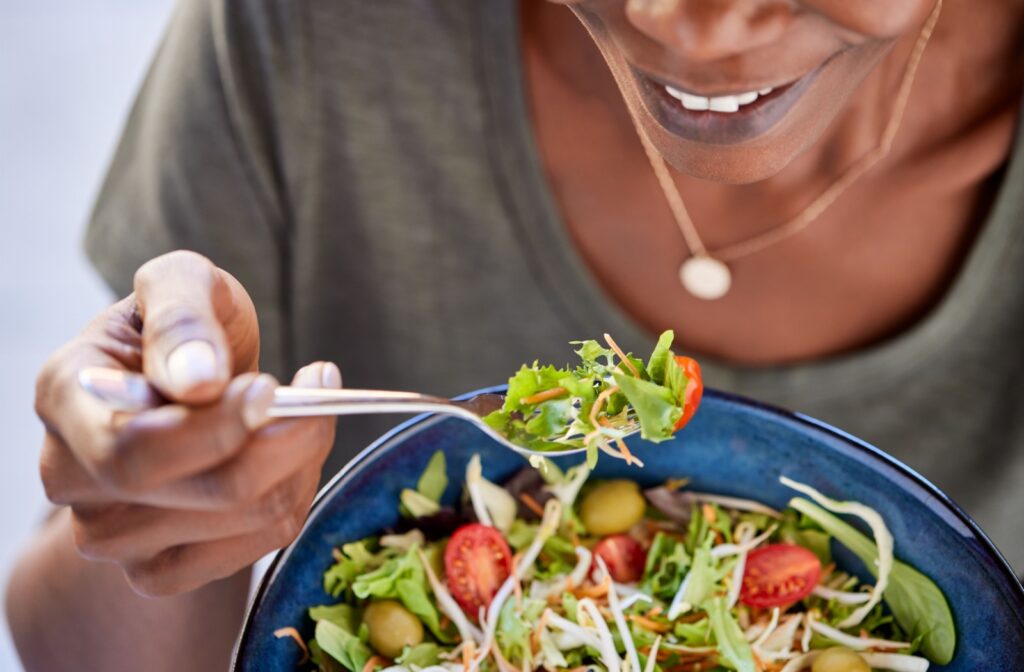 Woman eating healthy now to enjoy good eye health down the road.