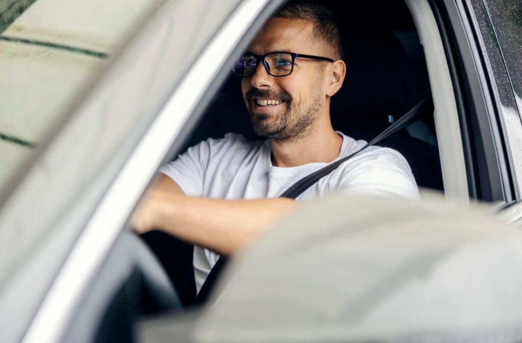 A person wearing glasses commuting to work.